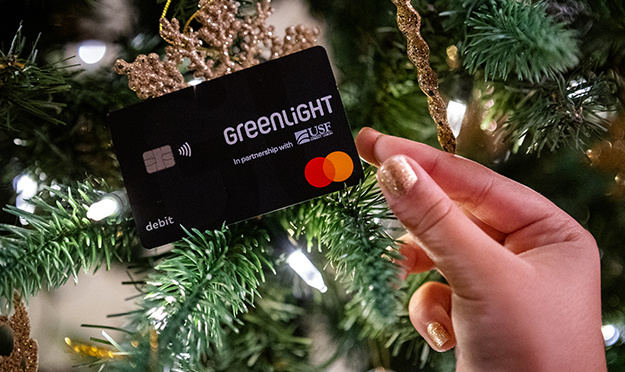 Greenlight debit card on a Christmas tree